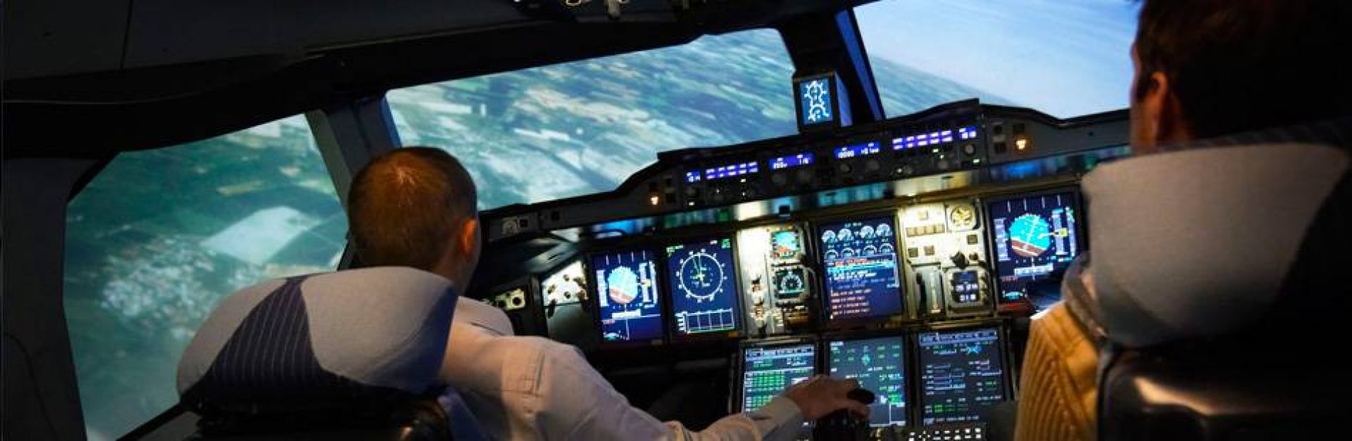 Simulator flight Airbus A380 cockpit ProFlight pilots in the cockpit of an A380 at an angle.